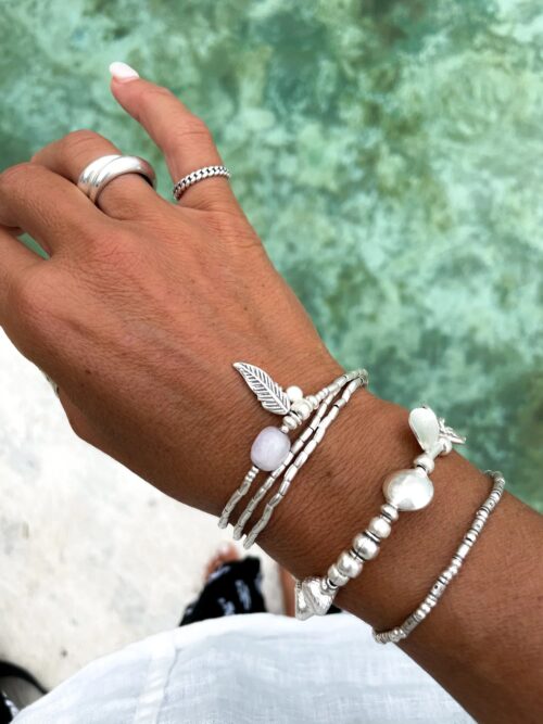 ocean inspired silver jewellery. Pure silver wrap bracelet with silver feather charm and kunzite gemstone - for a beach vibes look- water safe for everyday wear. 3 styles in 1
