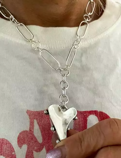 warped heart silver necklace