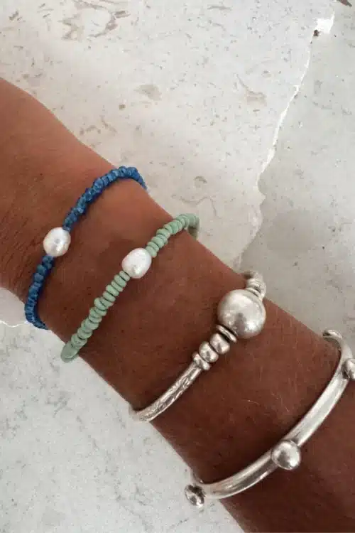 colourful summer bracelet. heishi glass pearl bracelets styled in a bracelet stack ocean safe.