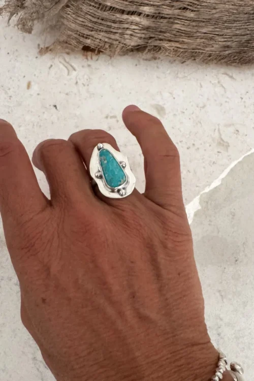 hand cut organic sterling silver ring with natural turquoise gemstone.